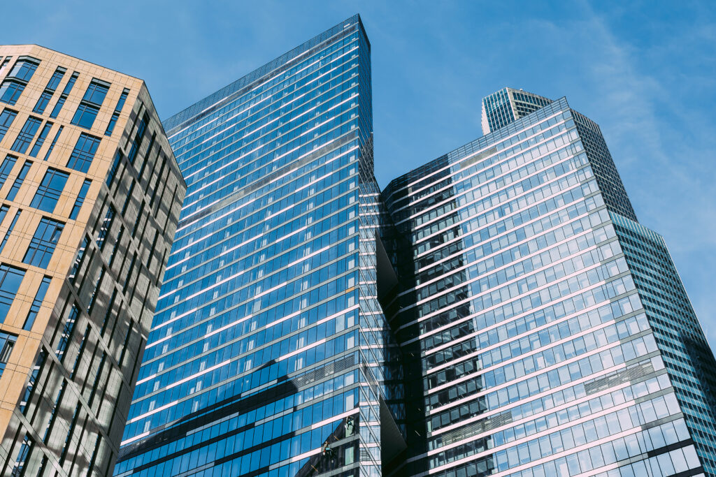 High rise office buildings pictured on a sunny day.