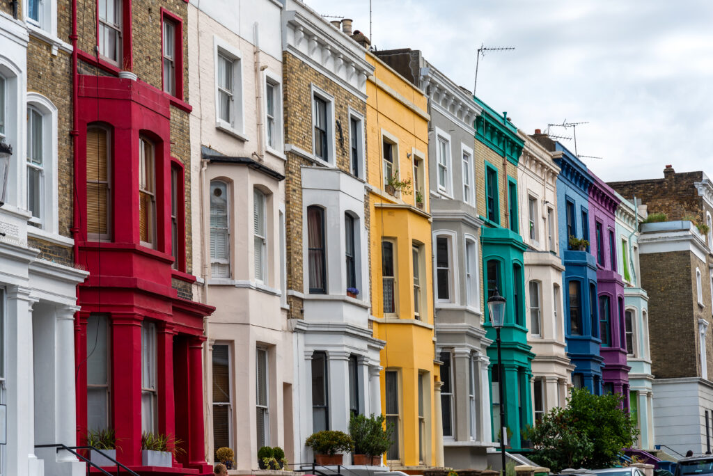 A row of colourful terraced houses located in Notting Hill, London.