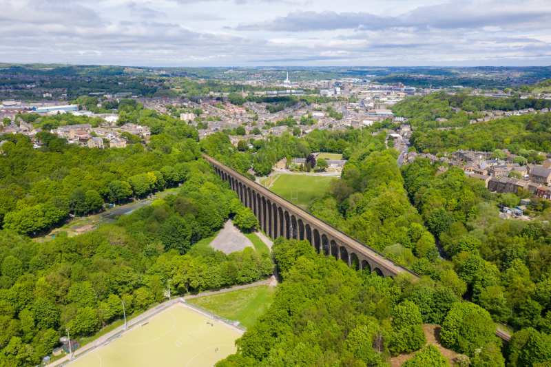 An aerial photo of the Lockwood Viaduct in Huddersfield on a sunny day.